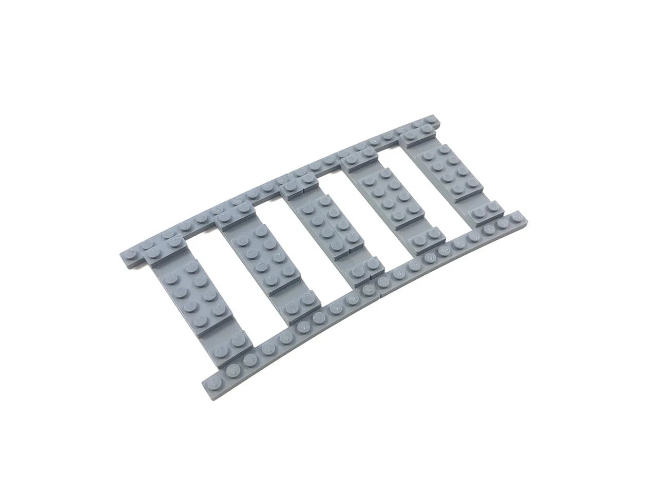 Snap-on ballast plates for train tracks